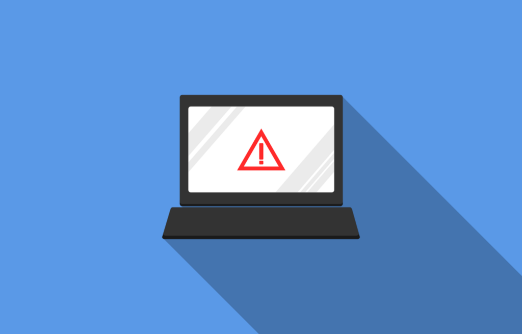 A laptop screen showing a data breach alert sign